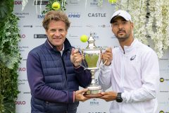 LIVERPOOL, ENGLAND - Saturday, June 18, 2022: Men's 2022 Champion Dimitar Kuzmanov (BGR) is presented with the Boodles Trophy by Tournament Director Anders Borg (L) during Day 3 of the Liverpool International Tennis Tournament 2022 at Liverpool Cricket Club. (Pic by David Rawcliffe/Propaganda)